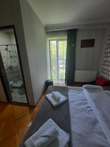 A bed or beds in a room at GIO-NIKA