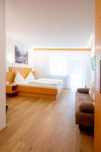 Postel nebo postele na pokoji v ubytování Hotel Gabriel