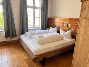 Säng eller sängar i ett rum på Pension Stellwerk Ilsenburg