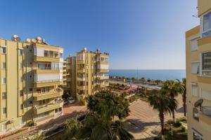 a view of the beach from the apartment buildings at Pleasant Flat near Beach with Sea View in Alanya in Kargicak