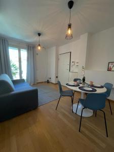 a living room with a couch and a table and chairs at La Mì Casa - Home in Florence in Florence