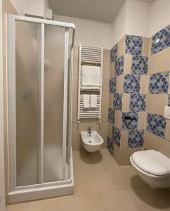 a bathroom with a shower and a toilet and a sink at La Mì Casa - Home in Florence in Florence