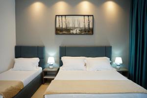 Postel nebo postele na pokoji v ubytování Atrium Deluxe Resort