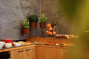 a buffet with a bunch of food on a table at Atrium Deluxe Resort in Golem