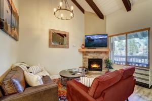 a living room with two couches and a fireplace at Private condo steps from ski lift minutes to lake in Stateline