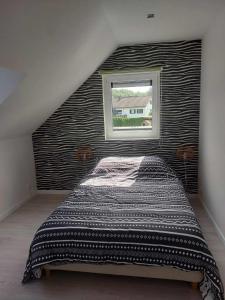 Letto o letti in una camera di Gite Comme chez soi