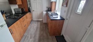 a kitchen with a sink and a counter top at Sheffield City Suites in Manor