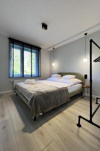 Postel nebo postele na pokoji v ubytování VISLA Apartments 2