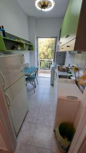 Φωτογραφία από το άλμπουμ του Beachfront apartment 10m from the beach στην Παραλία Διονυσίου