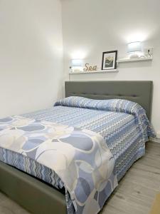 a bedroom with a bed in a white room at SeaView Nicotera Marina in Nicotera Marina