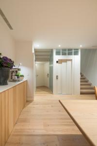 a hallway of a house with a staircase at Porto Real Hotel in Finisterre
