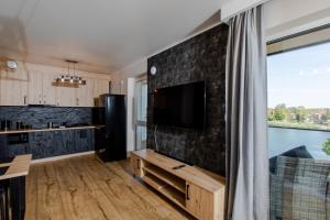 TV a/nebo společenská místnost v ubytování Apartament Water Wings by Major Domus Club