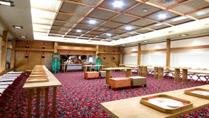 a large room with tables and chairs and a classroom at Hotel Satsukien - Vacation STAY 75962v in Kanoya