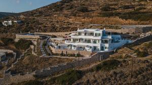 an aerial view of a house on a hill at Castello Amorgos Suites in Katapola