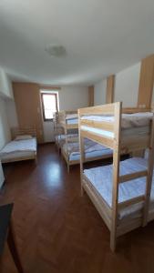 a group of bunk beds in a room at Hostel in picerija Špajza in Mojstrana