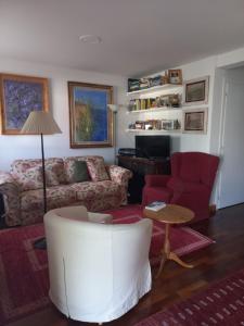 a living room with a couch and a chair at B&B il Ciliegio di Maura in Massimeno
