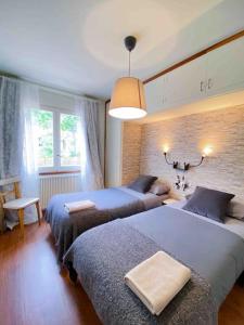 Rúm í herbergi á Típica Casa Andorrana en Encamp l by BonesVacances
