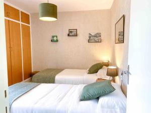Rúm í herbergi á Típica Casa Andorrana en Encamp l by BonesVacances