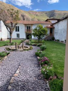 a stone path in front of a house at Casa Tía María Yucay in Yucay