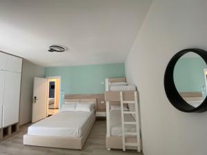 Postel nebo postele na pokoji v ubytování Helena Hotel