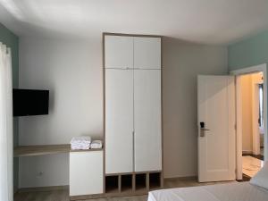 Postel nebo postele na pokoji v ubytování Helena Hotel