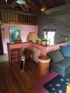a living room with a couch and a table at La Borda de Allué in Huesca