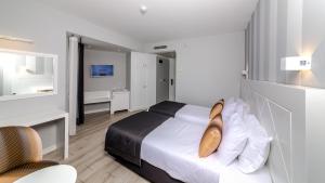 Кровать или кровати в номере Motto Premium Hotel&Spa