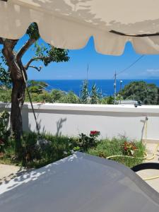 a table with a view of the ocean at Le Case dei Pescatori - Roseto in Ponza +10 photos