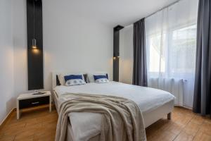 Postel nebo postele na pokoji v ubytování Apartments Vesna