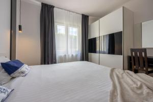 Postel nebo postele na pokoji v ubytování Apartments Vesna