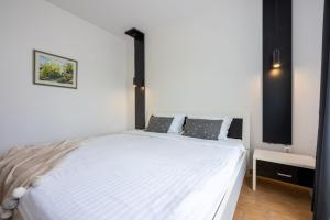 Postel nebo postele na pokoji v ubytování Apartments Vesna