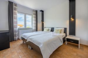 Postel nebo postele na pokoji v ubytování Apartments Vesna
