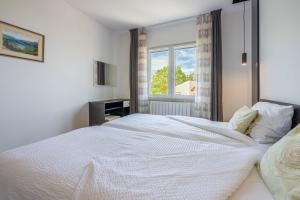 Postel nebo postele na pokoji v ubytování Apartments Vesna