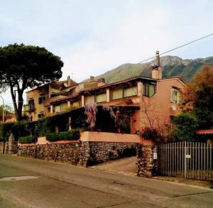 a large house on the side of a street at The Secret Garden Maratea - Casa di Elena in Maratea