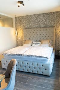 Ein Bett oder Betten in einem Zimmer der Unterkunft Maison Charlemagne Kelmis