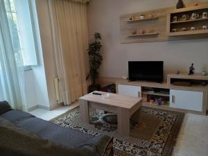 a living room with a couch and a coffee table at Casa López in San Mamede de Carnota