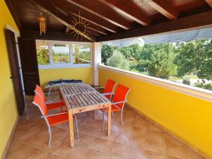 a dining room with a table and chairs at Apartments KUĆA SUNCE in Vodnjan +16 photos