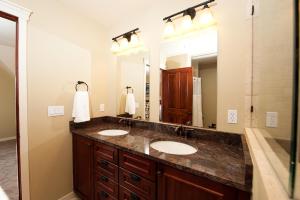 a bathroom with two sinks and a large mirror at 270 E College Drive Unit 206 in Durango +17 photos