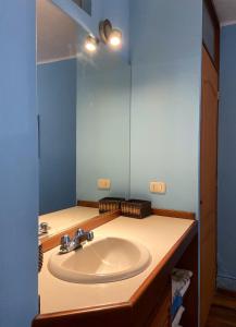a bathroom with a sink and a mirror at R° | 1BR apartment infront Chorrillos Sea in Lima