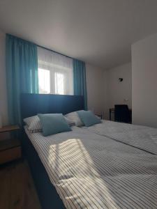 Pokoje i apartamenty MatDar客房内的一张或多张床位