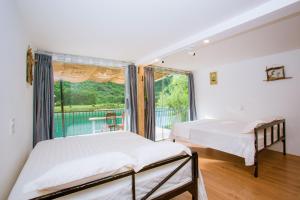 Postel nebo postele na pokoji v ubytování Phong Nha A Little Leaf Homestay + 37 fotografií