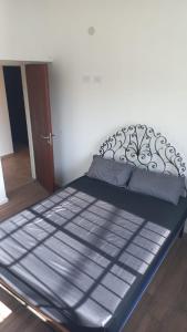 a large bed in a room with aoked at Descanso en Las Acequias in Roldán +12 photos