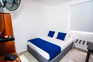 Postel nebo postele na pokoji v ubytování Hotel Casa 10