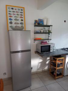 Kuchyň nebo kuchyňský kout v ubytování Logement du soleil
