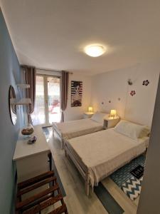 Posteľ alebo postele v izbe v ubytovaní Apartments and rooms by the sea Rovinj - 19183
