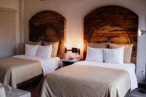 Postel nebo postele na pokoji v ubytování Hotel Rocaval San Cristóbal de las Casas