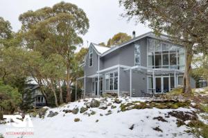 a house on a hill in the snow at Chalet 26 in Thredbo