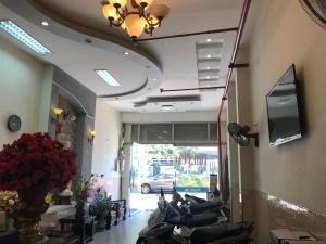 a lobby with a bunch of motorcycles parked in a room at Thiên Các Hotel in Quy Nhon