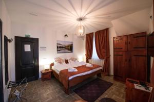 En eller flere senger på et rom på Gardoš rooms