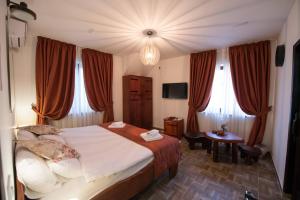 En eller flere senger på et rom på Gardoš rooms